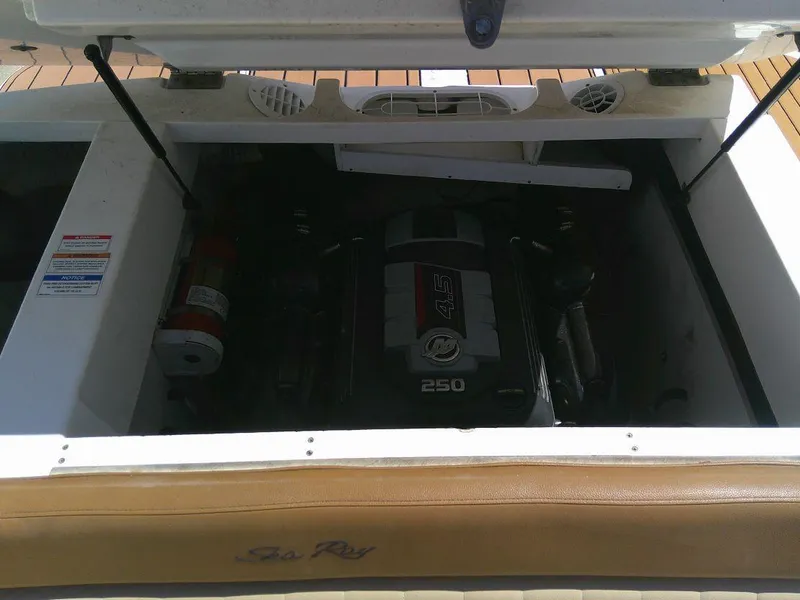 Slide: The Image of 2018 Sea Ray SPX 230 engine compartment with visible 250 horsepower engine. - 14