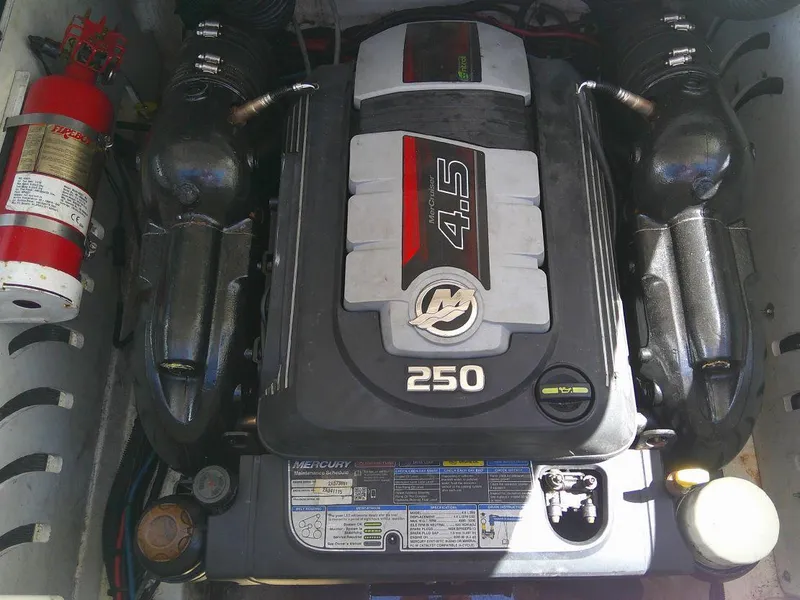 Slide: The Image of 2018 Sea Ray SPX 230 engine compartment with Mercury 4.5L 250 HP engine. - 4