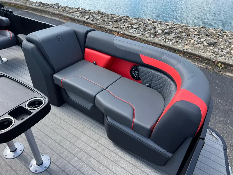 Slide: The Image of Luxurious seating on 2025 Godfrey SWEETWATER 2286 SFL pontoon boat, near water. - 12
