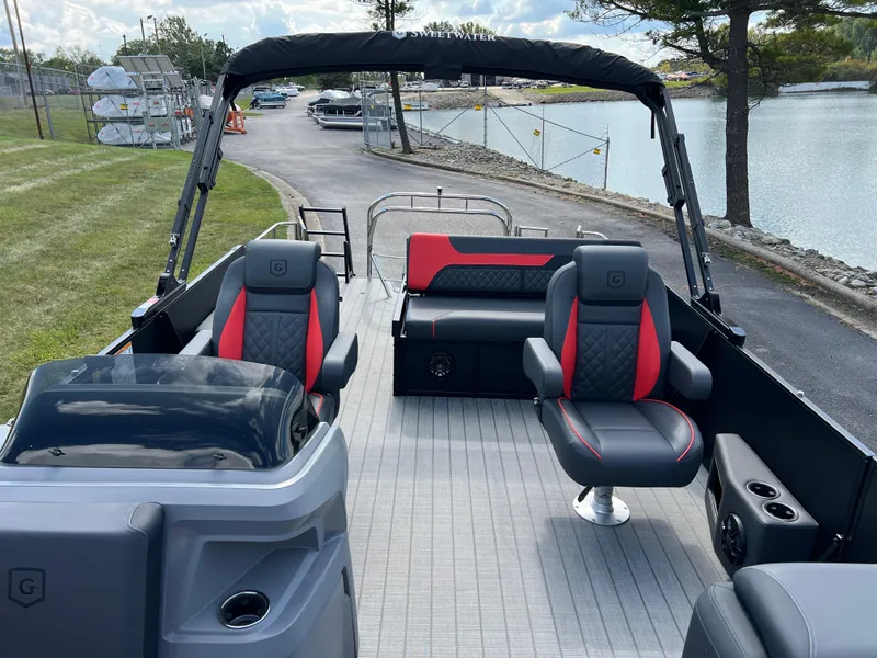 Slide: The Image of 2025 Godfrey SWEETWATER 2286 SFL pontoon boat interior with stylish seating and helm. - 13