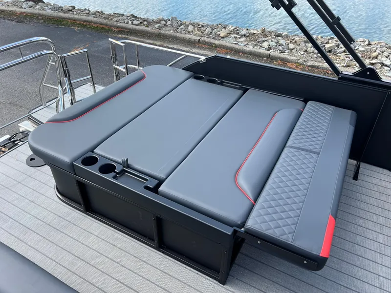 Slide: The Image of 2025 Godfrey SWEETWATER 2286 SFL boat seating with sleek gray upholstery and red accents. - 21