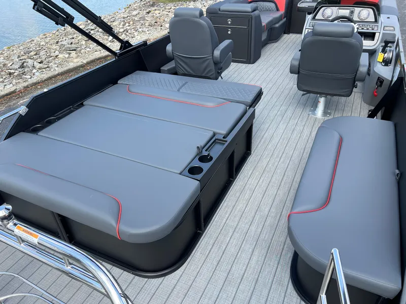 Slide: The Image of 2025 Godfrey SWEETWATER 2286 SFL pontoon boat interior with gray seating and modern design. - 23