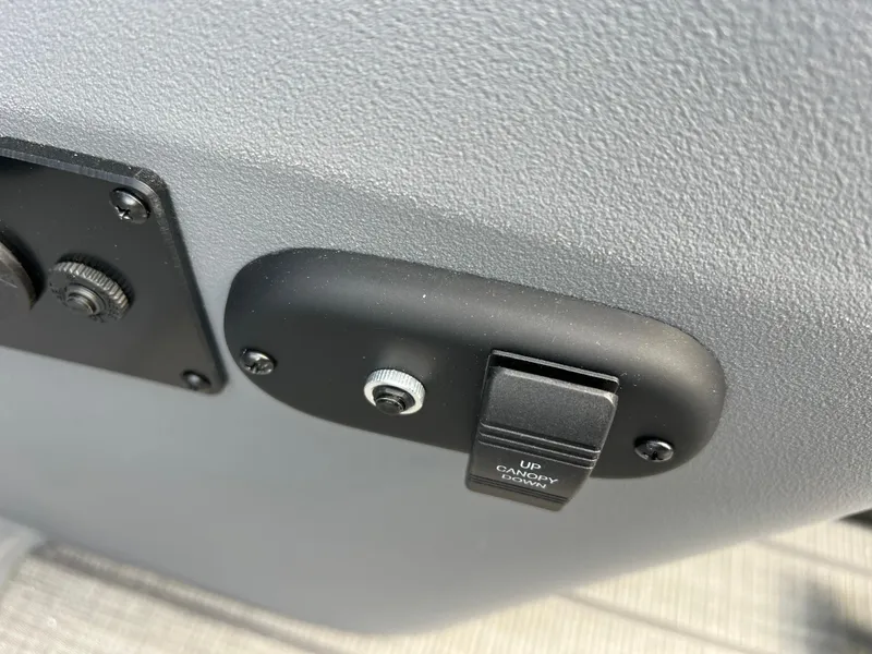Slide: The Image of Control panel on 2025 Godfrey SWEETWATER 2286 SFL boat, featuring canopy switch. - 28