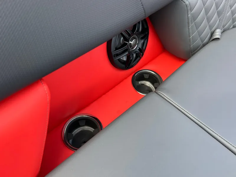 Slide: The Image of Interior of 2025 Godfrey SWEETWATER 2286 SFL with red accents and cup holders. - 35
