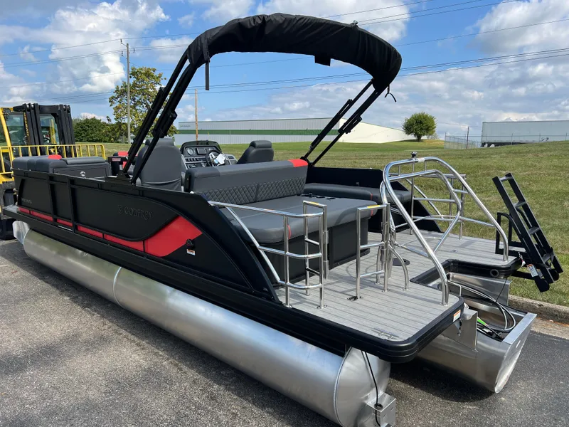 Slide: The Image of 2025 Godfrey SWEETWATER 2286 SFL pontoon boat with black canopy and sleek design. - 7