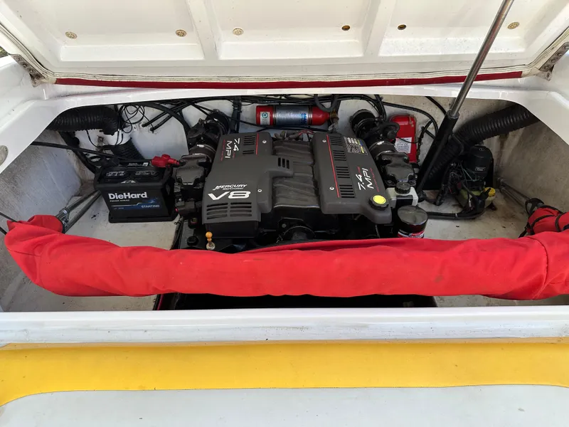 Slide: The Image of 2001 Baja 232 boat engine compartment with V8 engine and DieHard battery. - 17