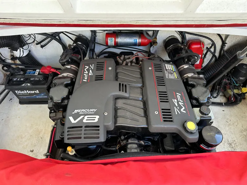 Slide: The Image of 2001 Baja 232 engine compartment with Mercury MerCruiser V8 engine and DieHard battery. - 18