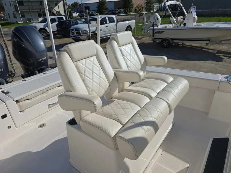 Slide: The Image of 2021 Blue Wave 2800 Makaira boat with dual cushioned seats and powerful engines. - 10