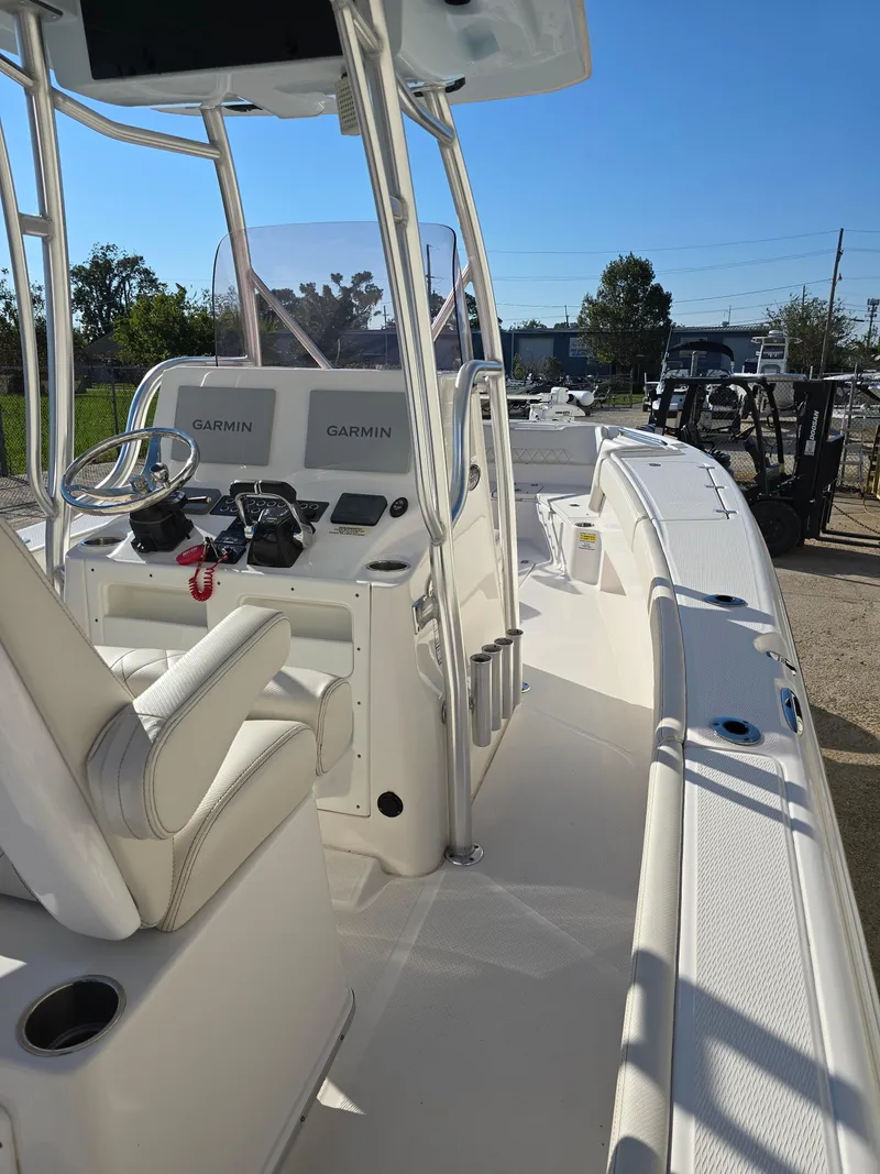 Slide: The Image of 2021 Blue Wave 2800 Makaira boat with Garmin navigation, sleek white interior. - 18