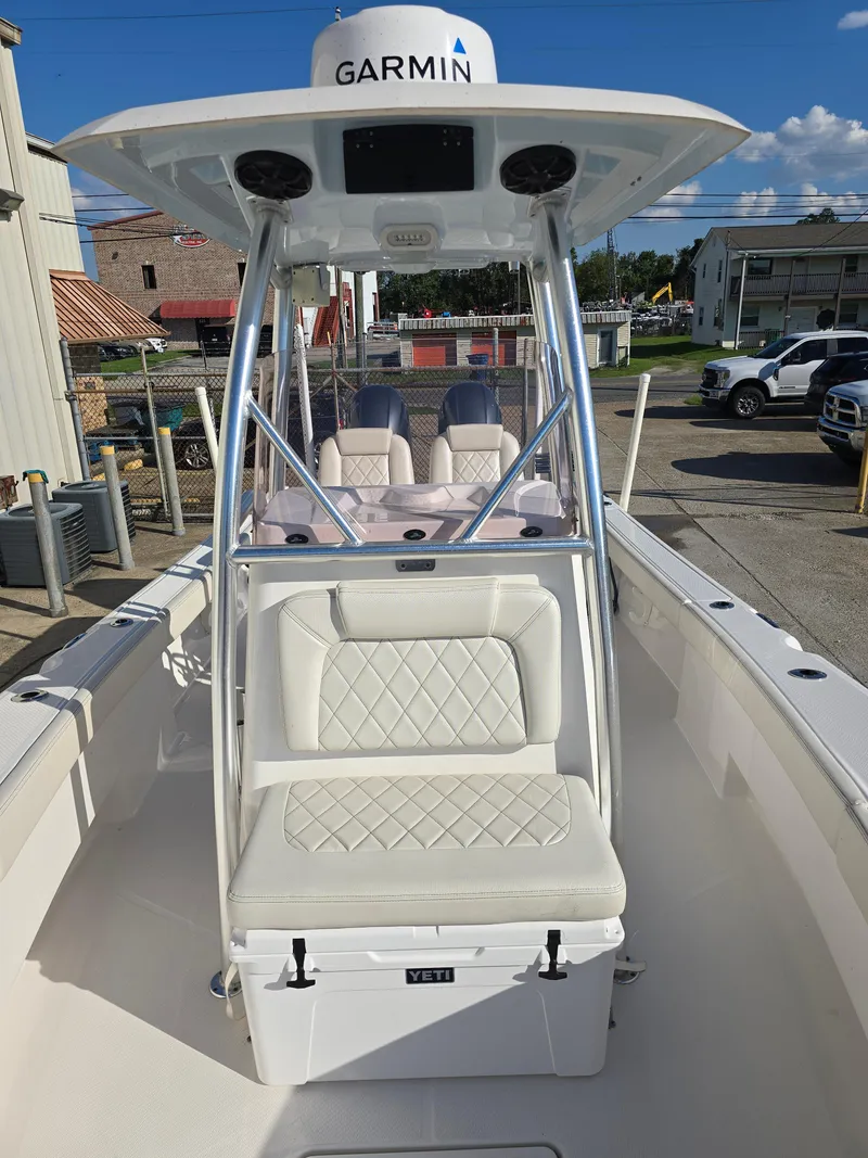 Slide: The Image of 2021 Blue Wave 2800 Makaira boat with Garmin equipment, featuring white seating and console. - 22