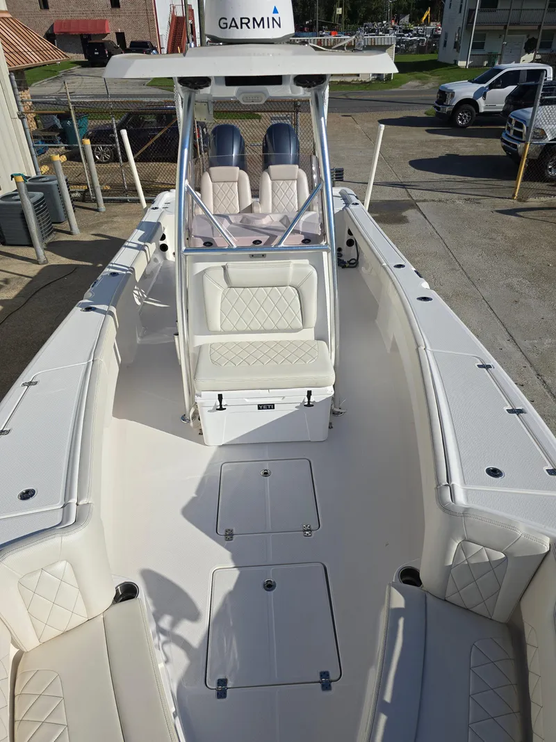 Slide: The Image of 2021 Blue Wave 2800 Makaira boat with spacious deck and seating. - 23