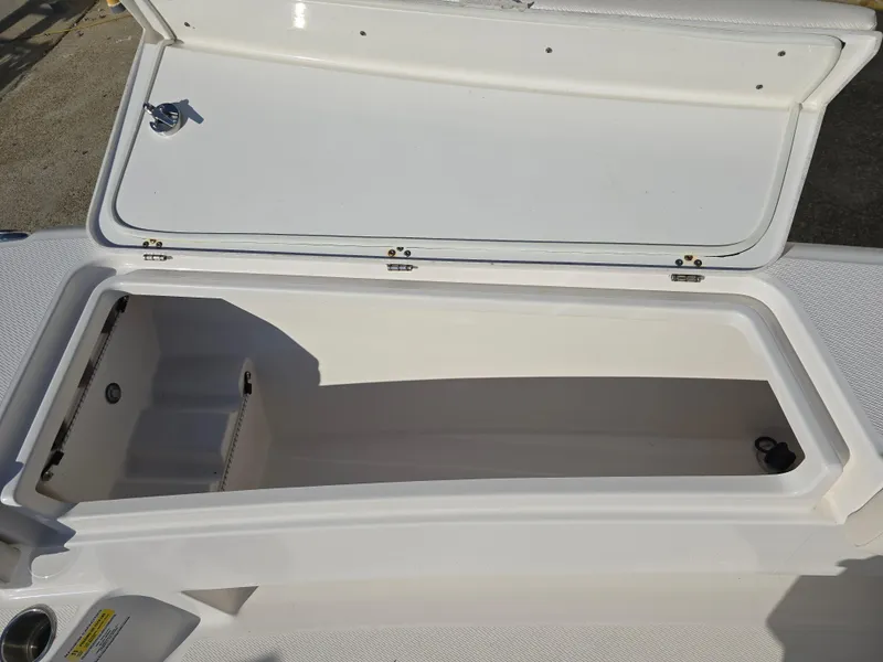 Slide: The Image of Open storage compartment on 2021 Blue Wave 2800 Makaira boat. - 25