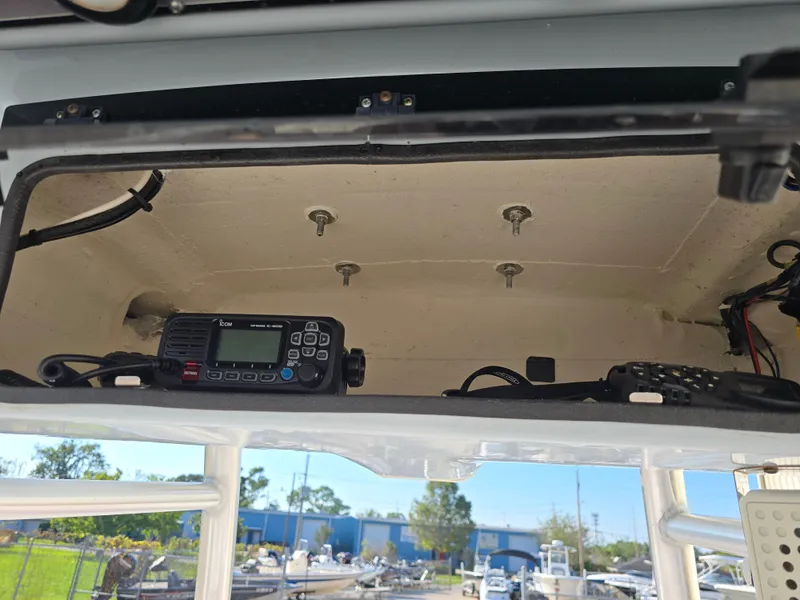 Slide: The Image of 2021 Blue Wave 2800 Makaira boat console with radio equipment. - 9