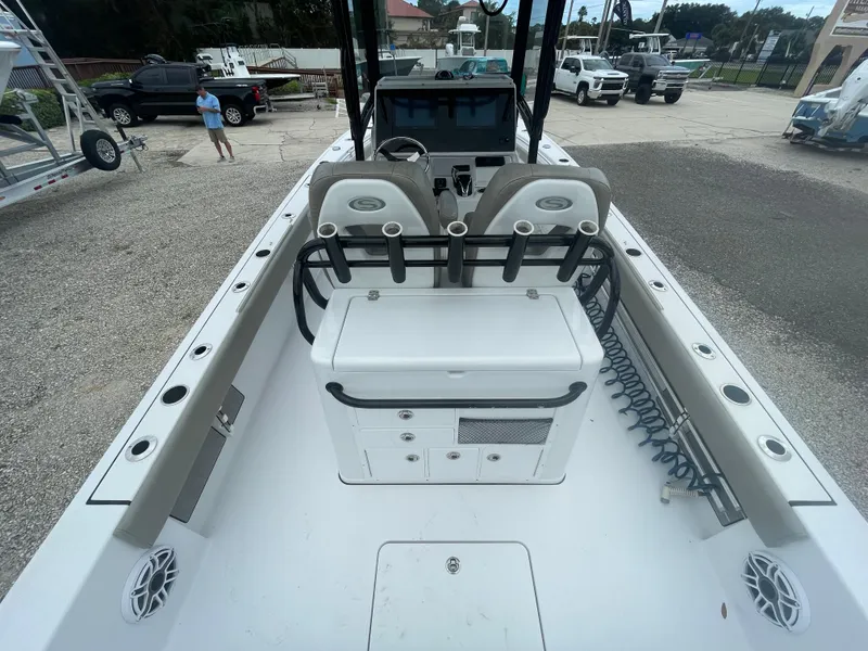 Slide: The Image of 2022 Sportsman Masters 267OE Bay Boat interior with dual seats and console. - 10