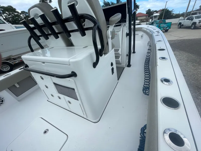 Slide: The Image of 2022 Sportsman Masters 267OE Bay Boat interior with seating and storage features. - 12