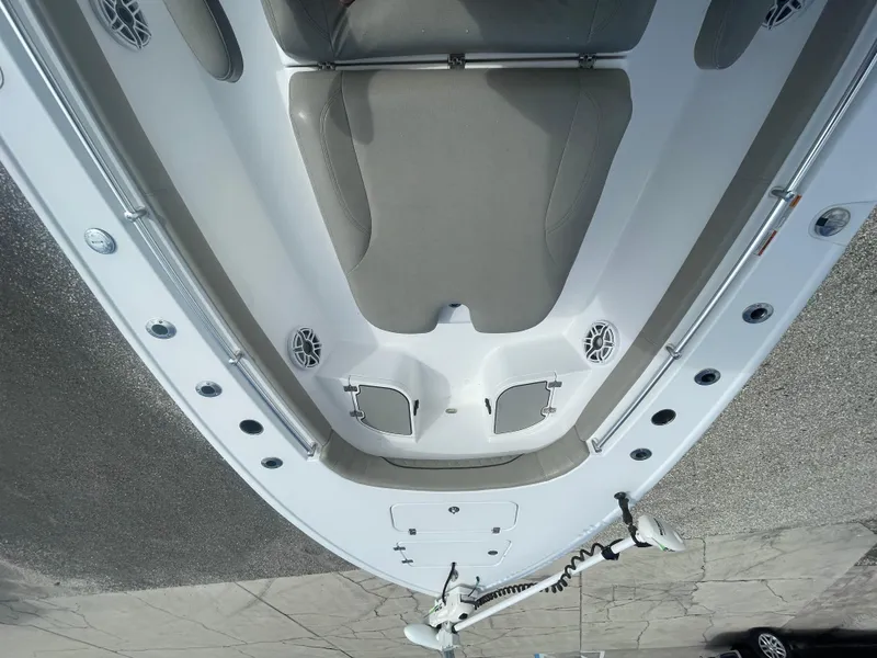 Slide: The Image of 2022 Sportsman Masters 267OE Bay Boat deck view with seating and storage compartments. - 18