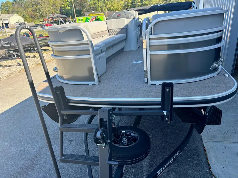 Slide: The Image of 2023 Ranger Reata 220C pontoon boat with spacious seating and trailer. - 3