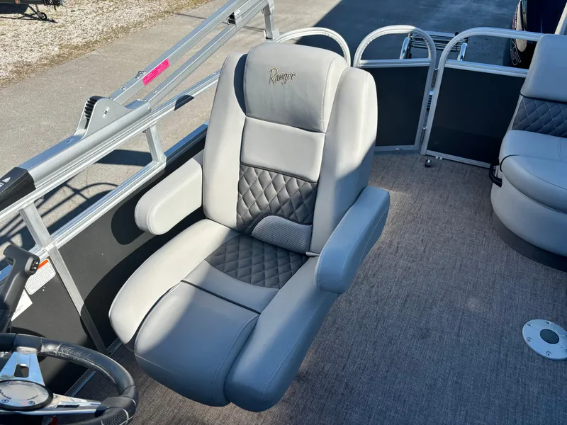 Slide: The Image of 2023 Ranger Reata 220C boat seat with quilted design and armrests. - 7