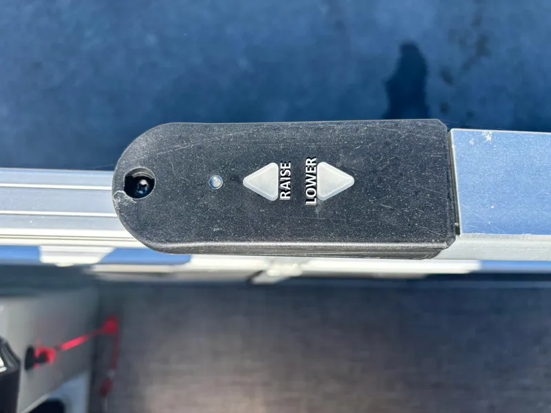 Slide: The Image of Control panel with "Raise" and "Lower" buttons on 2023 Ranger Reata 220C. - 9