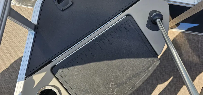 Slide: The Image of 2023 Sun Tracker Fishin' Barge 20 DLX deck with cup holder and railing. - 14