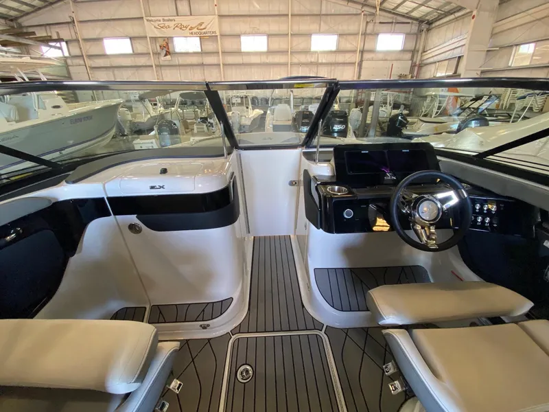 Slide: The Image of 2025 Sea Ray SLX 260 Outboard boat interior with modern dashboard and seating. - 10