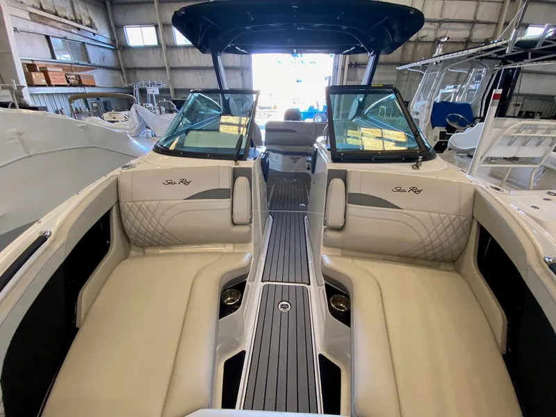 Slide: The Image of 2025 Sea Ray SLX 260 Outboard interior with luxurious seating and sleek design. - 11