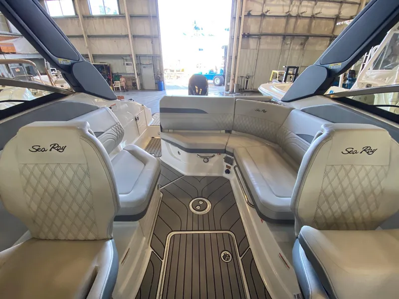 Slide: The Image of Luxurious interior of 2025 Sea Ray SLX 260 Outboard boat with elegant seating. - 13