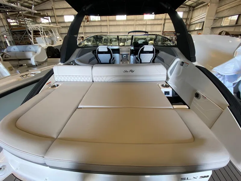 Slide: The Image of 2025 Sea Ray SLX 260 Outboard boat interior with luxurious seating and modern design. - 14