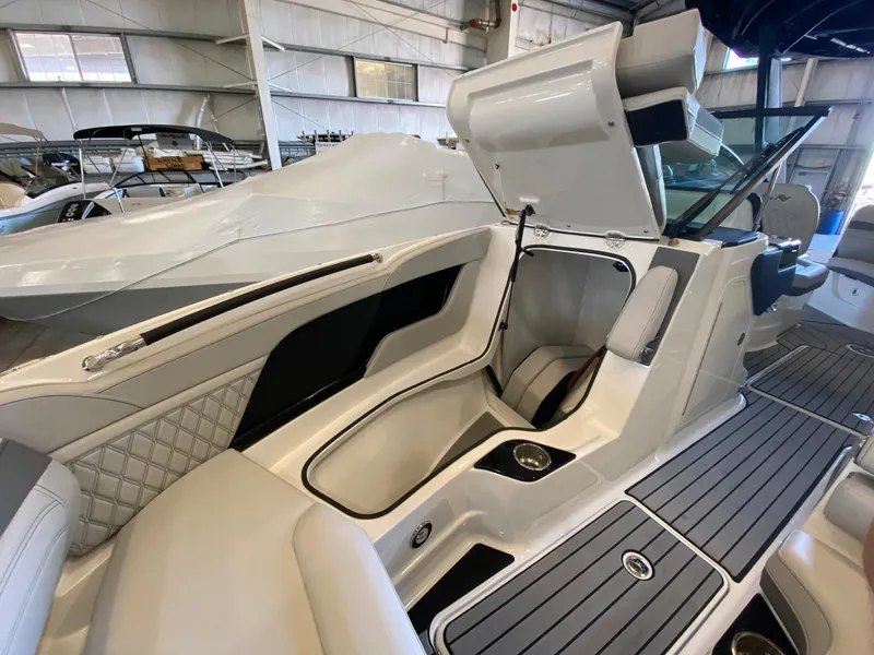 Slide: The Image of 2025 Sea Ray SLX 260 Outboard interior with luxurious seating and modern design. - 15