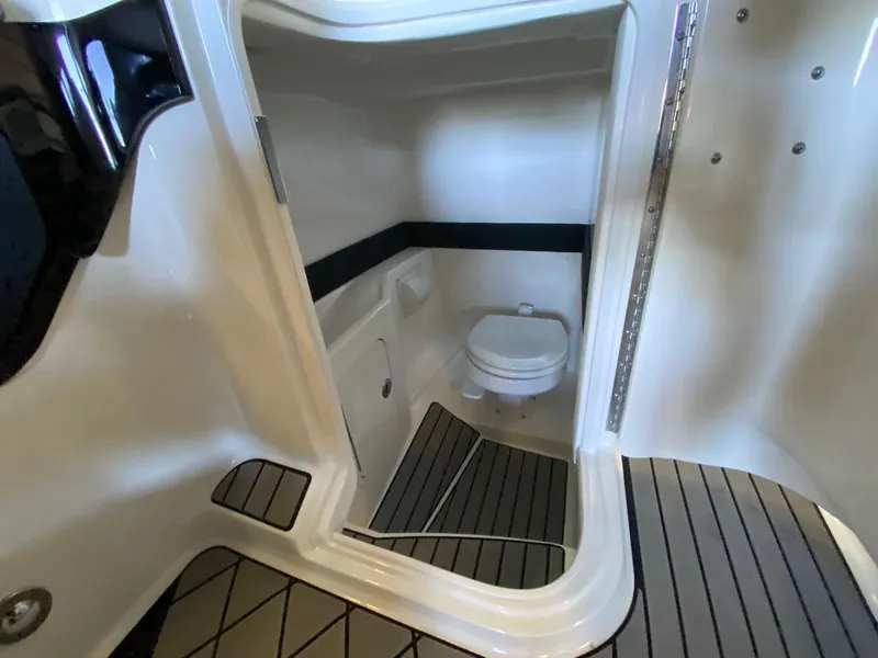 Slide: The Image of 2025 Sea Ray SLX 260 Outboard boat interior bathroom with modern design. - 17