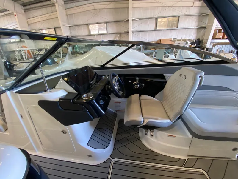 Slide: The Image of 2025 Sea Ray SLX 260 Outboard boat interior with modern helm and seating. - 7