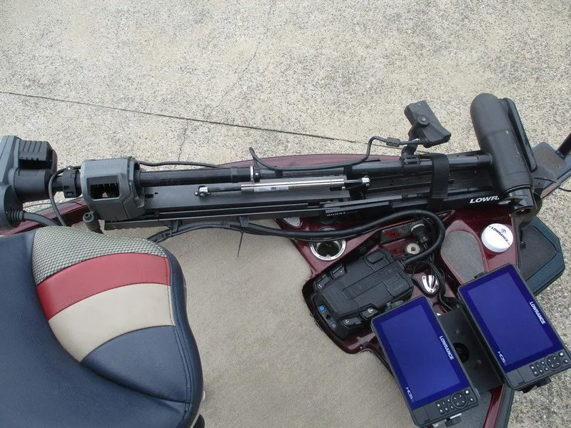 Slide: The Image of 2014 Bass Cat Puma FTD boat interior with electronics and seating. - 4