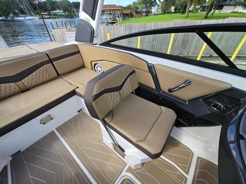 Slide: The Image of Interior of 2025 Monterey 235SS boat with tan seating and stylish design. - 20