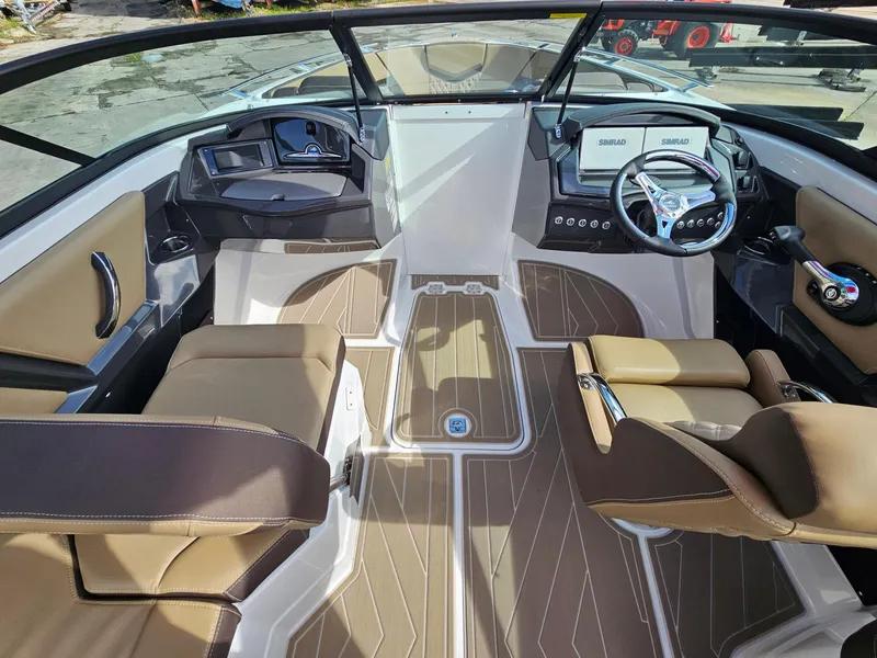Slide: The Image of 2025 Monterey 235SS boat interior with modern dashboard and comfortable seating. - 21