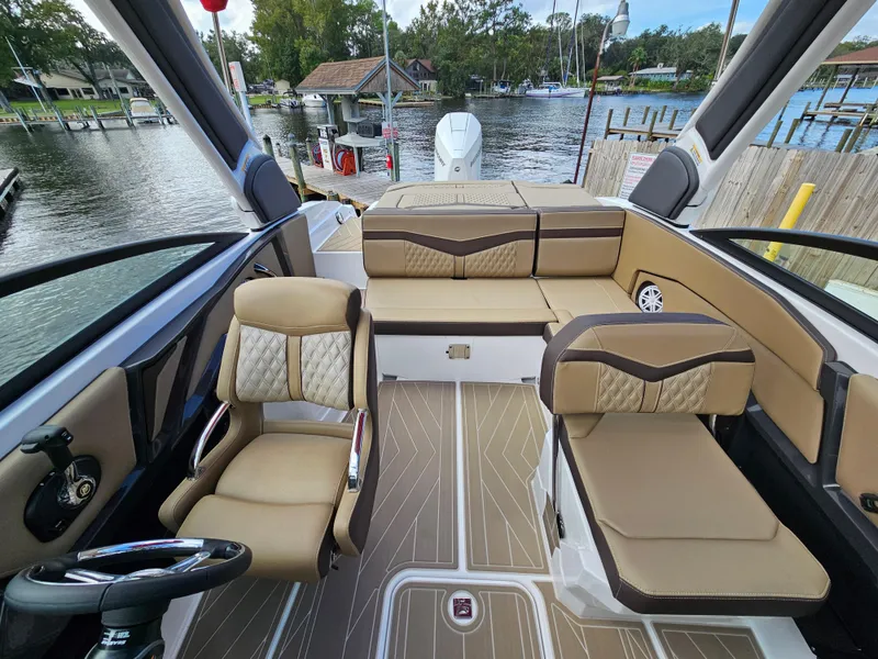 Slide: The Image of Interior of 2025 Monterey 235SS boat with beige seating and modern design. - 34