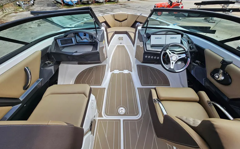 Slide: The Image of 2025 Monterey 235SS boat interior with modern dashboard and luxurious seating. - 35