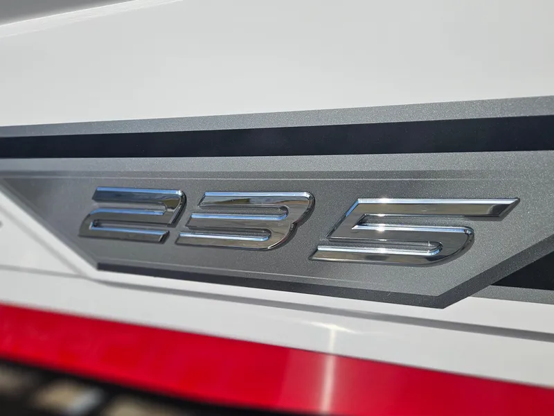 Slide: The Image of 2025 Monterey 235SS boat emblem with sleek silver design on a white background. - 37