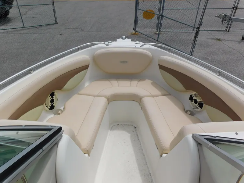 Slide: The Image of 2008 Chaparral 204 SSi boat interior with beige seating and speakers. - 6