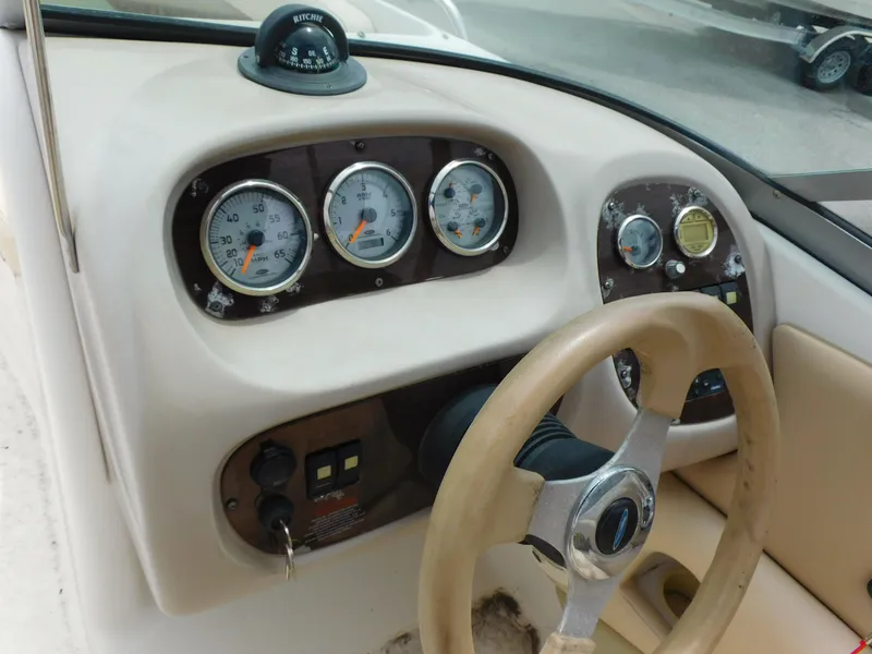 Slide: The Image of Dashboard of 2008 Chaparral 204 SSi boat with gauges and steering wheel. - 8