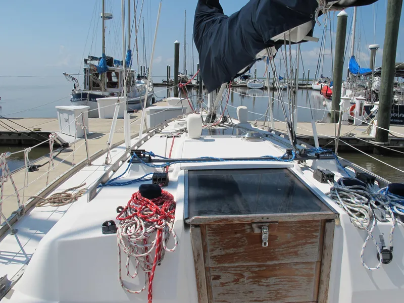 Slide: The Image of 1987 Sabre 34 sailboat deck with ropes and marina view. - 3