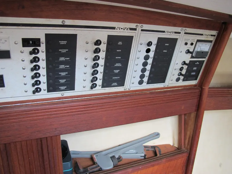 Slide: The Image of Electrical panel on a 1987 Sabre 34 sailboat, featuring switches and controls. - 6