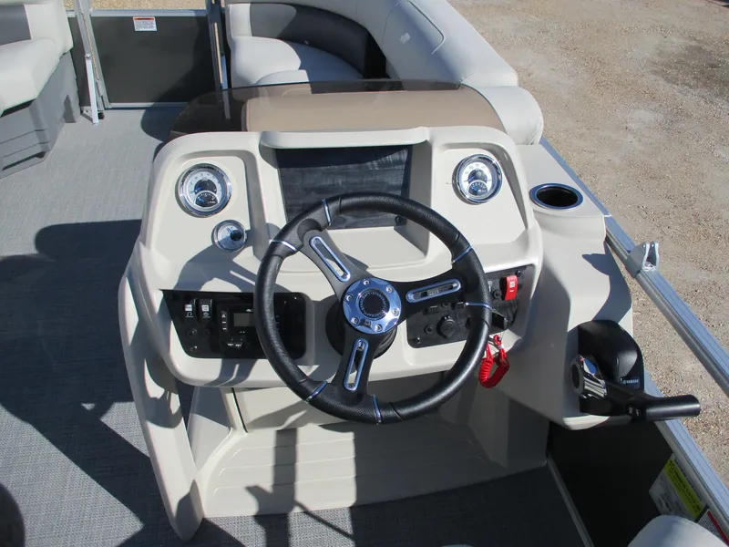 Slide: The Image of Steering console of 2025 Starcraft LX 20 CB boat with modern controls and seating. - 12