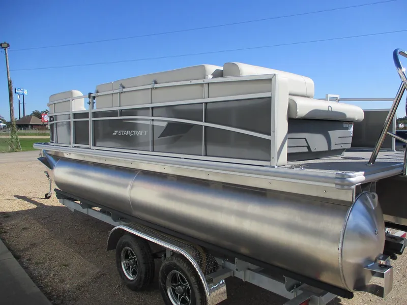 Slide: The Image of 2025 Starcraft LX 20 CB pontoon boat on trailer, side view. - 4