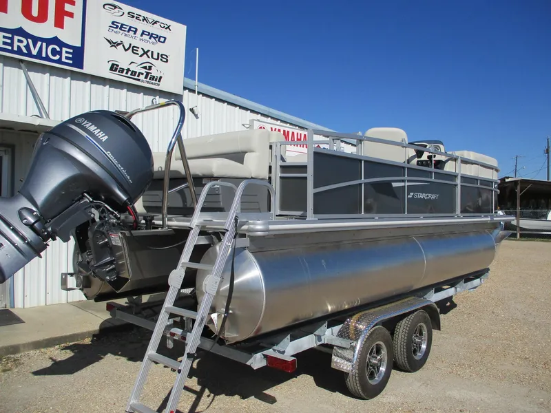 Slide: The Image of 2025 Starcraft LX 20 CB pontoon boat on trailer with Yamaha outboard motor. - 6