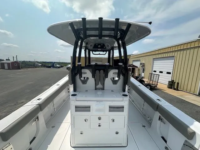 Slide: The Image of 2025 Sportsman 282 Open boat interior with T-top and storage compartments. - 11