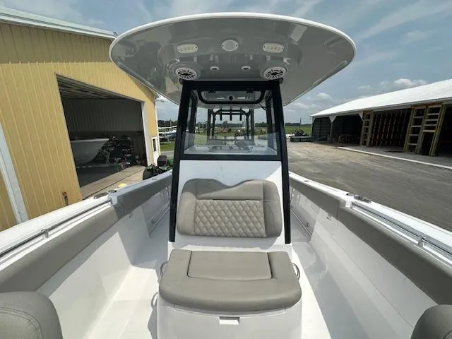Slide: The Image of 2025 Sportsman 282 Open boat interior with cushioned seating and overhead console. - 18