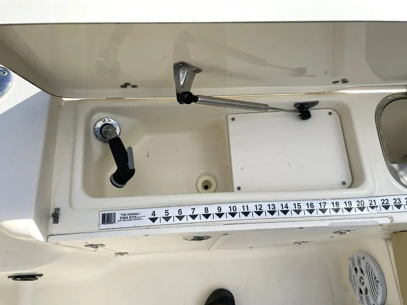 Slide: The Image of Scout 242 Abaco 2006 boat interior with measuring scale and storage compartment. - 9