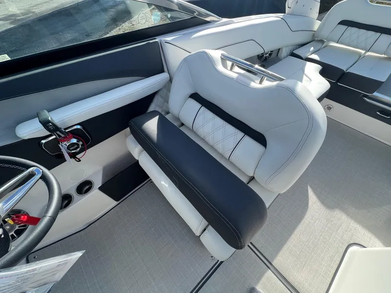 Slide: The Image of 2025 Regal LS4 boat interior with modern seating and steering wheel. - 10