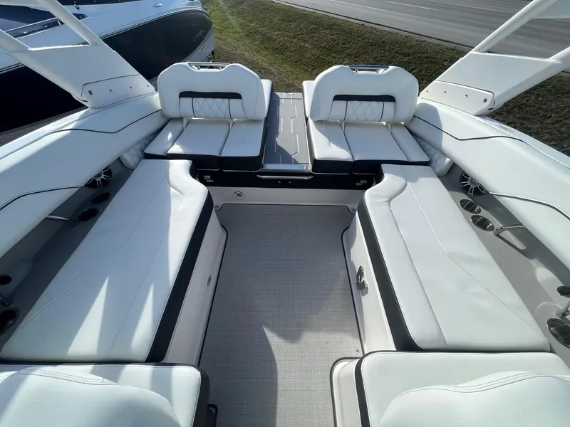 Slide: The Image of Luxurious 2025 Regal LS4 boat interior with white seating and sleek design. - 4