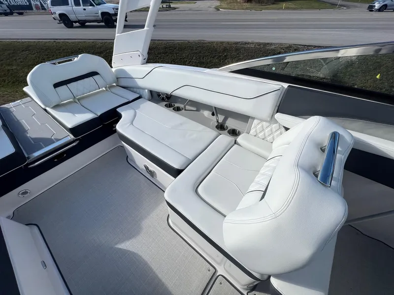 Slide: The Image of 2025 Regal LS4 boat interior with white leather seating and modern design. - 5